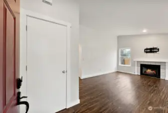 Front door opens into the Living space. Coat closet on left.