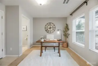 First floor den with natural light and powder room