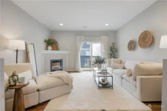 Living room with builder upgraded hardwood flooring