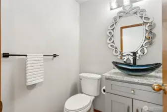 Updated main floor bath with quartz countertop.