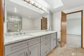 The vanity in the primary bath has an updated quartz countertop.