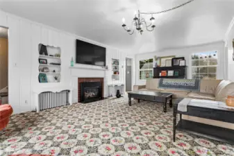 Charming built-ins flank the cozy fireplace.