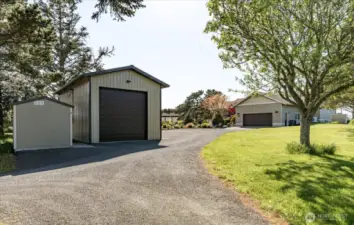 As you enter the drive, there is a storage shed and the detached shop