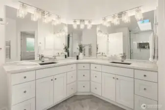 primary bathroom with dual vanities