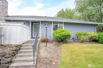 Entrance of Home just across from swimming pool. Exterior and lawn covered by HOA.