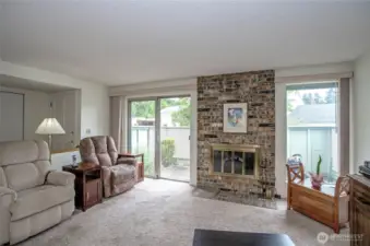 Living room with wood buring fireplace. Has an electric 'fake fire' in there now.