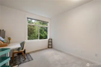 On the left side of the Hall way near the Second Bathroom you'll find the Second Bedroom. This Bedroom Faces South Easterly, with Beautiful Views of the Sitting Park and Greenbelt through a Large  Window With Custom Trim & Mill Work for a truly Picturesque "Good morning".