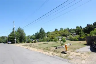 From street to NE.  Sewer in street, electrical front, water in street