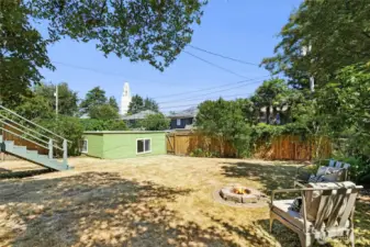 A one car garage is found in the level backyard and is accessed from the alley. Just add a play structure or trampoline !