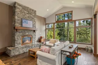 Great room with stone fireplace and tons of natural light!