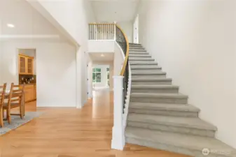 Grand staircase and open concept as soon as you open the front door!
