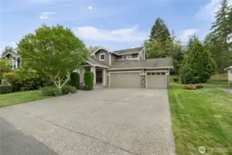 Three car garage and large driveway for extra parking.