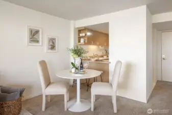 The dining area divides the Living Room from the charming Kitchen.