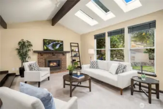 Light bright floor-to-ceiling windows have been recently updated, along with super skylights and a warm gas fireplace. This is a space to enjoy!
