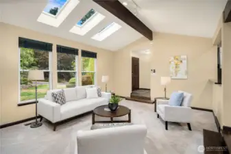 Skylights with remote shades add to the overall  brightness of the living space.