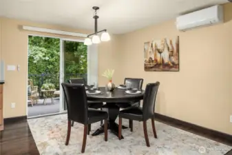 Dining area with access to covered deck with retactablle sun awning