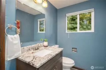 Powder room just off the lower level family room