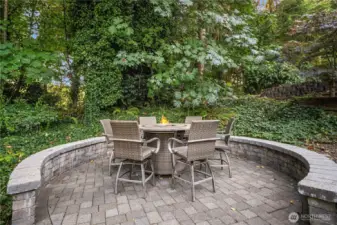 Elegant stone patio with fire-table