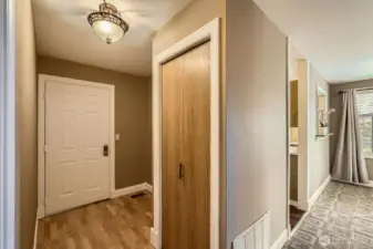 The front entry provides extra space for a table or bench and decorating.