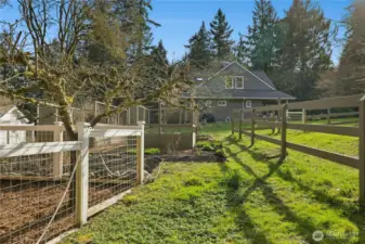 Fenced garden areas and orchard-style trees (cosmic crisp apples & plums) create a picturesque, productive landscape just beyond the home. This setting beautifully blends refined country living with everyday equestrian functionality.
