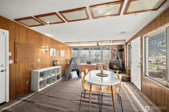 Through the french doors is a large enclosed outdoor patio/sun room.   This space offers truly endless possibilies!