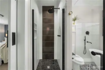 Walk in shower with designer tile details and overhead rain shower.