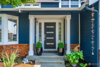 This welcoming front porch is dialed in and hints at the beautiful remodel that you'll find inside!