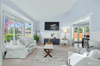 Light filled living room with vaulted ceilings is the perfect first impression when you enter this lovely home. This good sized room has plenty of options for furniture layout to make this a tv room or formal living room.