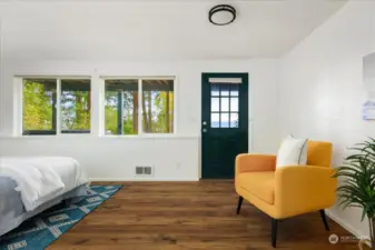 Door leading out to small patio below deck.