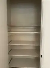 Where is your pantry? Right next to the kitchen. Convenient and deep, shelves are movable for any Costco runs you have in mind.