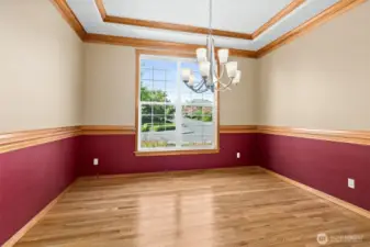 Displayed here with no furniture.  Formal dining room.