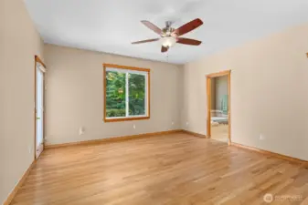 Master bedroom with a different angle of side door to patio.
