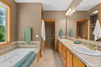 Double sinks and separate shower and soaking tub.