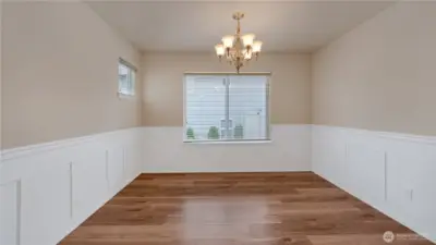Formal dining with wainscoting. Adjacent to kitchen.