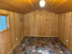 Outdoor shed with power has a new roof.