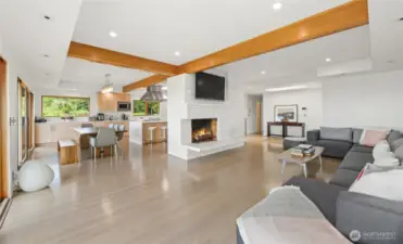The open floor plan living areas and stunning oak flooring.