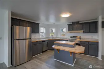 Spacious Kitchen with new appliances, and new laminated counter tops. Lots of storage.