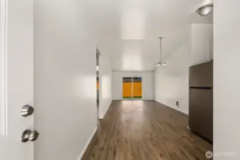 Unit B (on the right) with vaulted ceilings and vinyl wood plank flooring throughout!