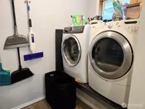 Lifted washer and dryer currently but would stack on the mop wall giving space for a full bathroom.