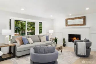 Freshly painted in 2020 in diamond white tone that flows throughout the home, the main living areas are enhanced with new recessed ceiling lights. Wide-plank European oak–style engineered hardwood floors installed in 2020 with a softly weathered finish and bluish-gray grain accents add warmth and character throughout the home.