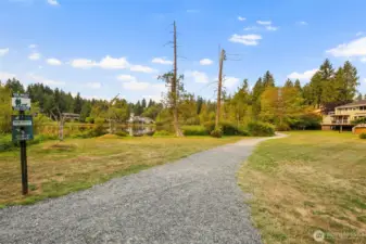 The well kept trail just beyond your back gate offers a peaceful path for morning walks, jogs, or evening strolls around the lake. Imagine evening strolls in a tranquil setting or refreshing morning jogs along the private neighborhood trail just beyond your backyard gate. This serene pathway around Hilton Lake offers daily moments of peace and connection to nature.