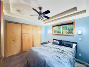 Bedroom: LPV flooring, built ins, ceiling fan, views of the Columbia river and the 5+ acres