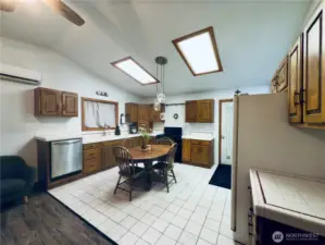 Dine in Kitchen: refrigerator, stove, dishwasher, plenty of cabinets, tile