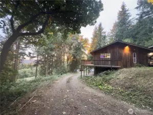 Circle driveway, home with views of the Columbia River, unfinished basement, full length deck, carport