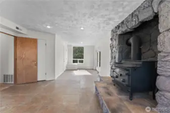 Recroom downstairs with wood burning stove.