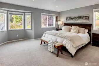 Large Primary Room with seating space in bay window area.