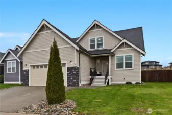 This attractive newer home features crisp modern finishes, stone accents, and inviting curb appeal in a desirable, well-kept neighborhood.