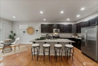 Large center island with seating—perfect for casual meals and gathering with guests.