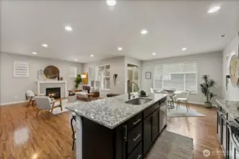 Spacious kitchen island with bar seating provides the perfect spot for casual dining or morning coffee.