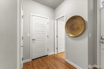 Door leads to the garage... it is an oversized two-car garage offering ample storage space plus a bump out area with room for tools, hobbies or a workbench.